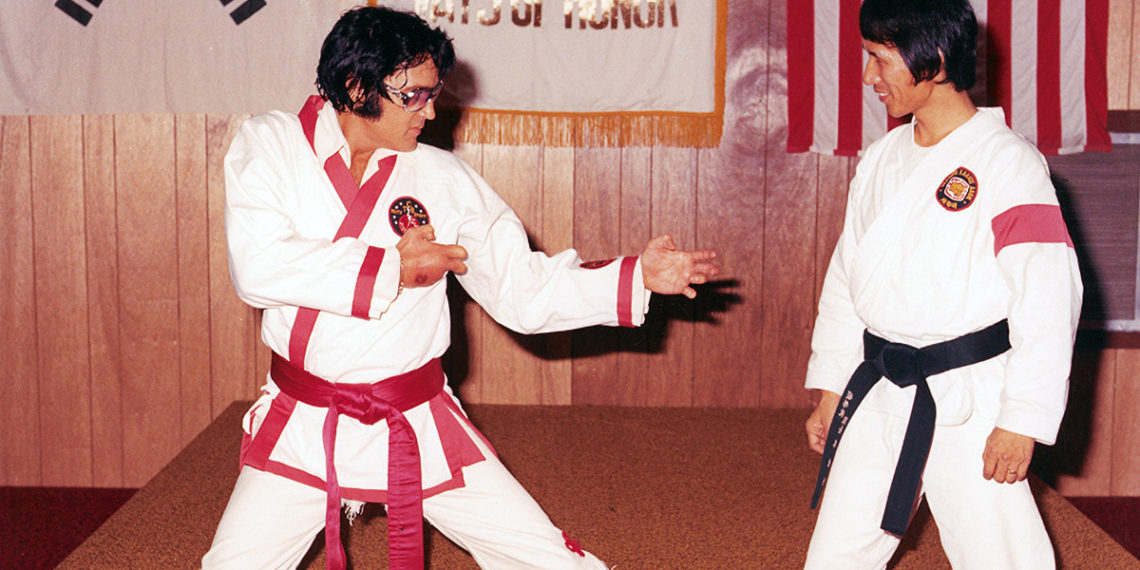 Photo of Elvis doing karate with Kang Rhee